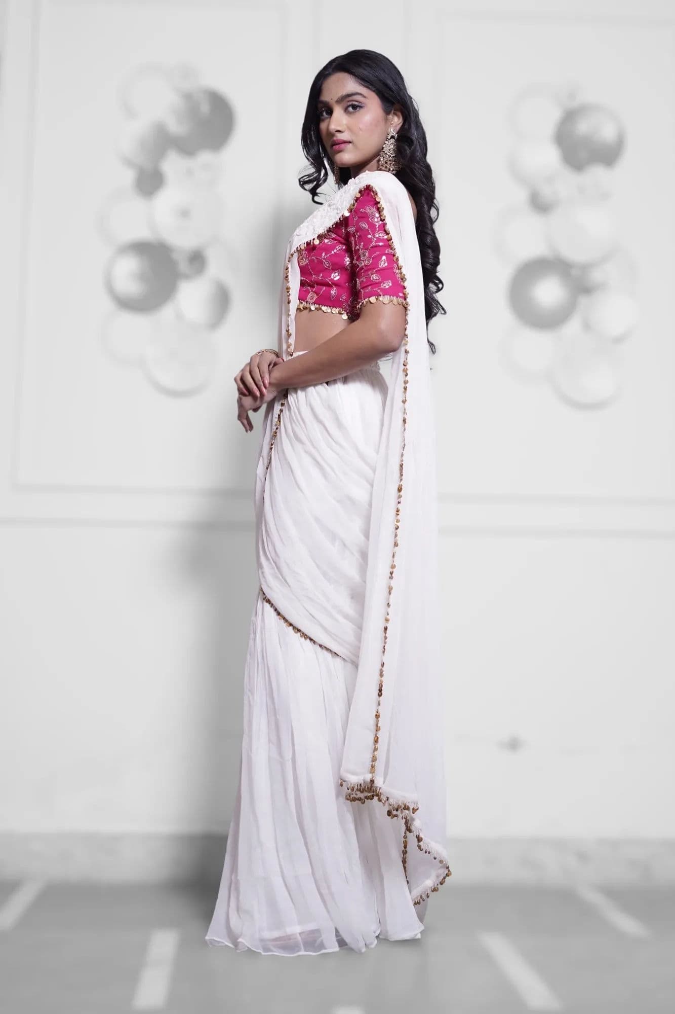 White saree with pink brocade blouse and beaded trim