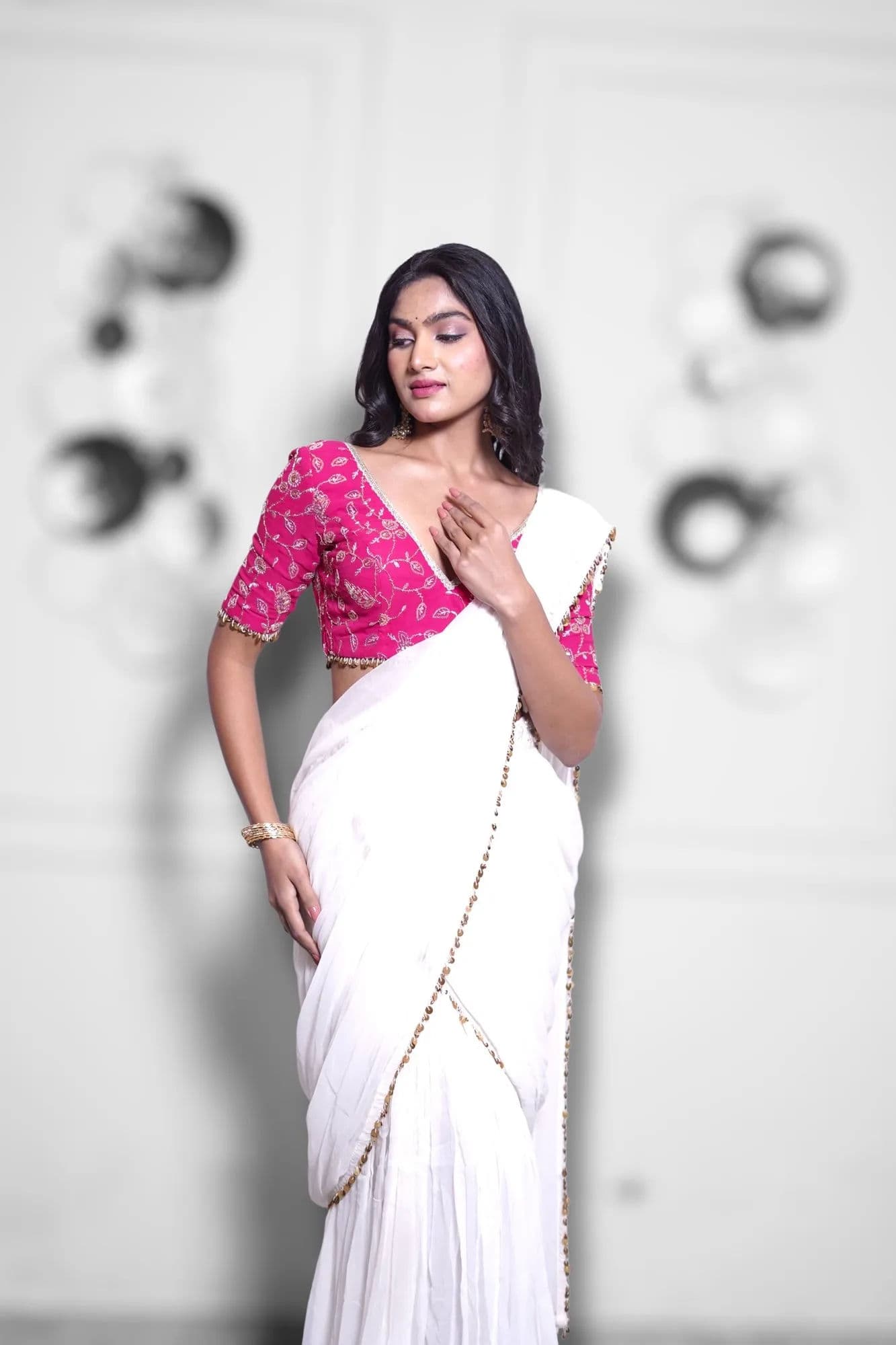White saree with pink brocade blouse and beaded trim 6